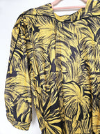 Zwierige gele vintage jurk met zwart patroon | L